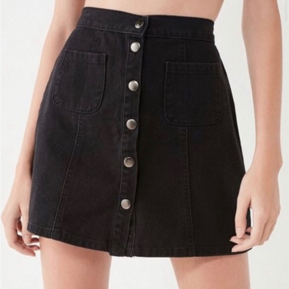 Black denim 2 pocket mini skirt with front snap closure